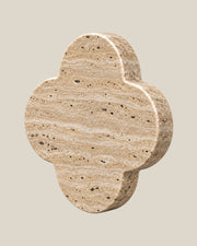ALHAMBRA Door Knob by ATOMS in Beige Travertine, angled view showing the rounded stone edge and natural mineral pattern.