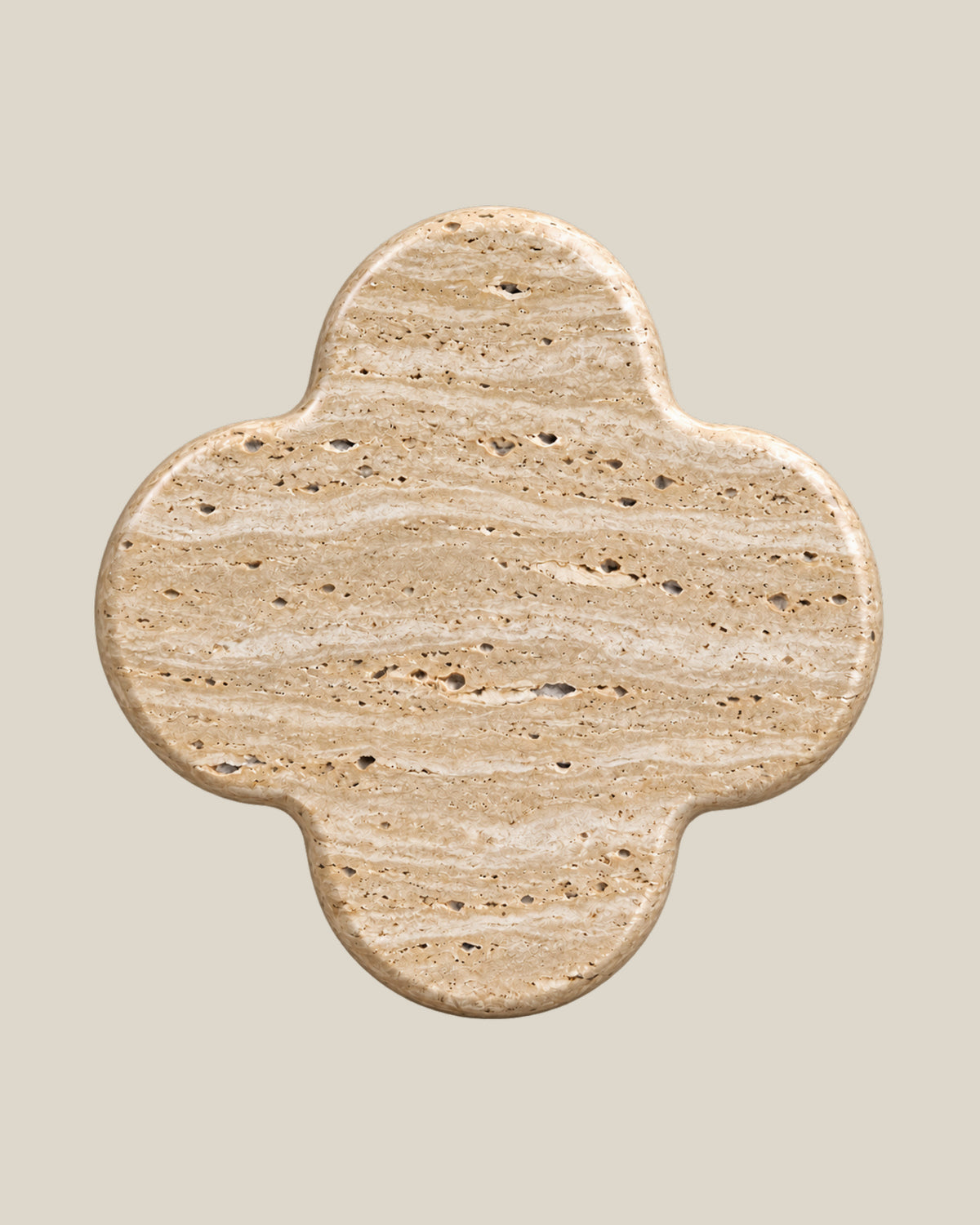 ALHAMBRA Door Knob by ATOMS in Beige Travertine, front view of the four-lobed natural stone face.