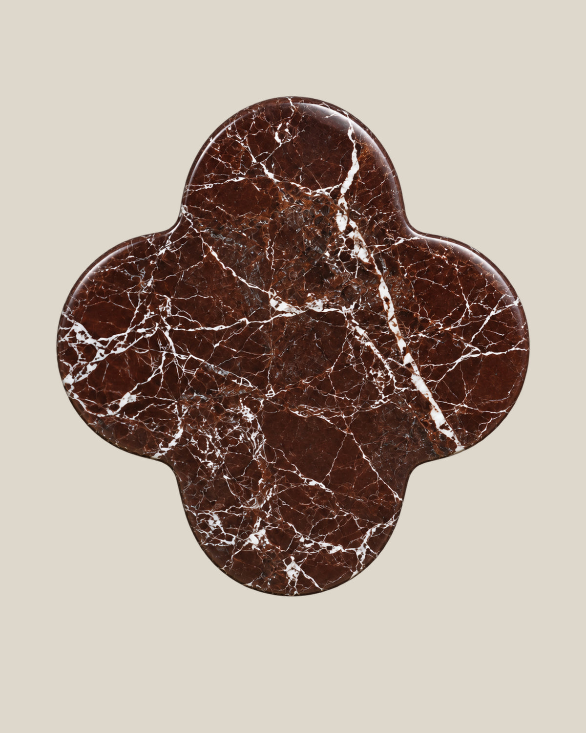 ALHAMBRA Door Knob by ATOMS in Burgundy, front view of the four-lobed natural stone face.