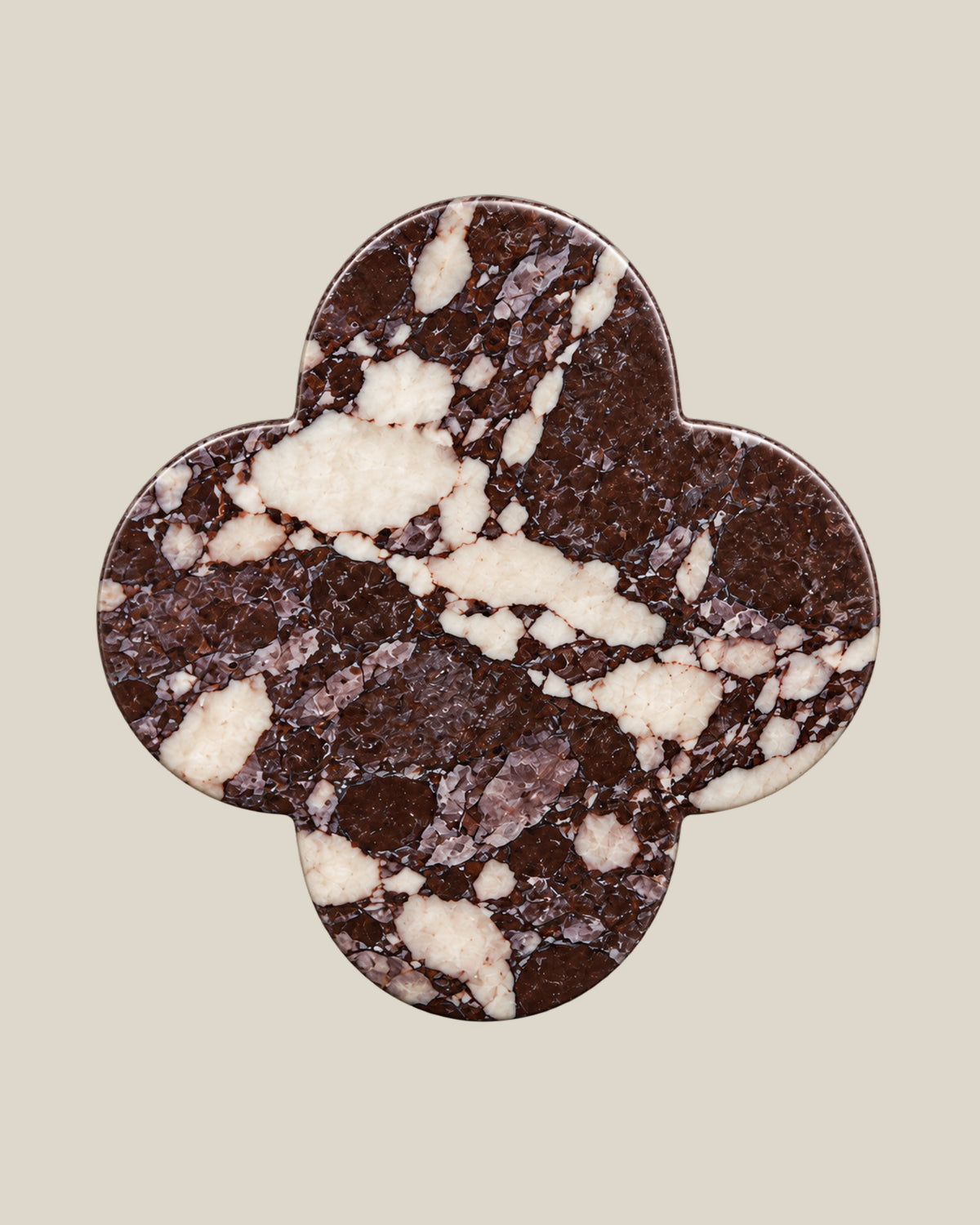 ALHAMBRA Door Knob by ATOMS in Red, front view of the four-lobed natural stone face.