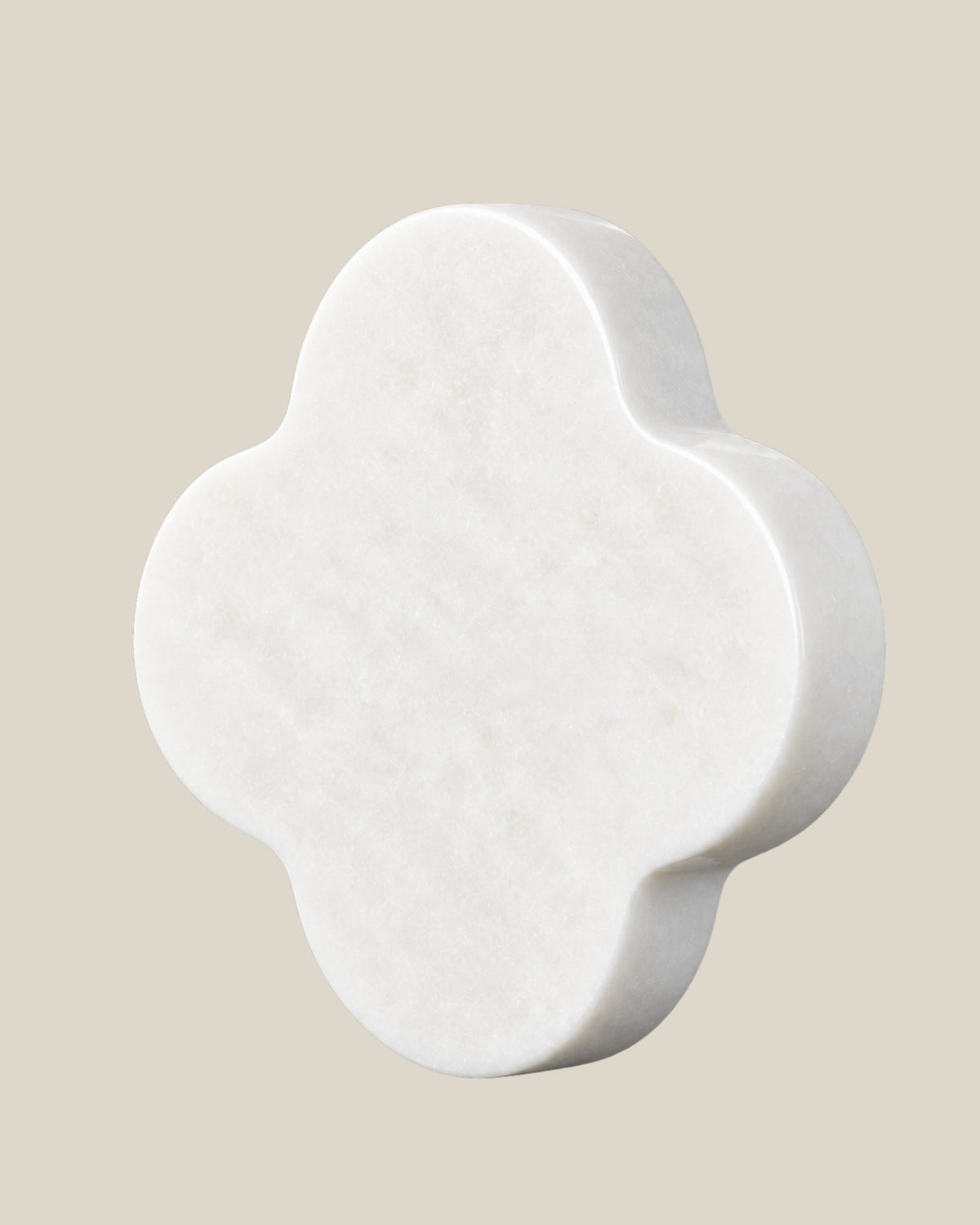 ALHAMBRA Door Knob by ATOMS in White, angled view showing the rounded stone edge and natural mineral pattern.