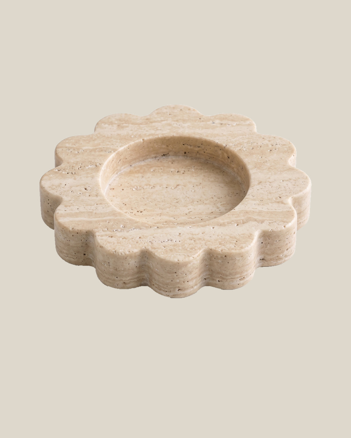 ATOMS Mini Sun Tray in Travertine Beige, three-quarter view on BONE background; 12.5 cm diameter and 2 cm thick.