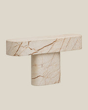 BUTTER console table by CARVINGS in Sofita Beige Marble, front-left view on a BONE background.