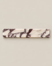 Overhead view of LINEA Incense Holder in Calacatta Viola marble.