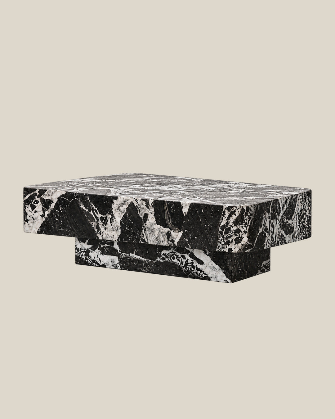 BUTTER coffee table by CARVINGS in Grand Antique Black Marble, on a BONE background, left view.
