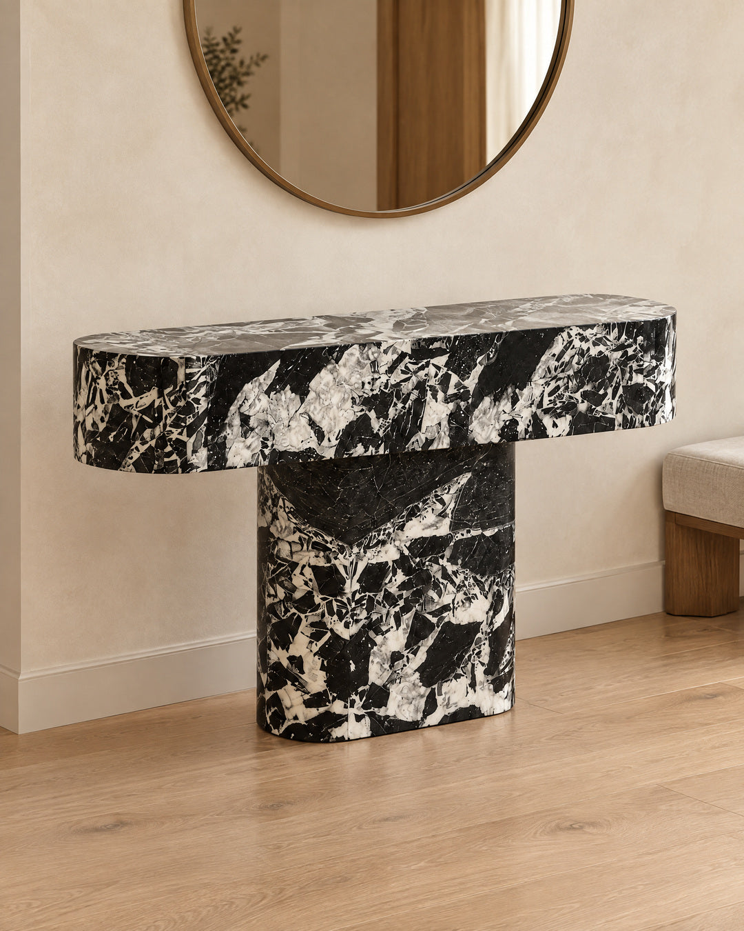 BUTTER console table by CARVINGS in Grand Antique Black Marble, in a styled interior, right view.