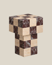 BUTTER side table by CARVINGS in Chequered Rosso Levante & Travertine Beige, on a BONE background, right view.