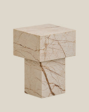 BUTTER side table by CARVINGS in Sofita Beige Marble, on a BONE background, right view.
