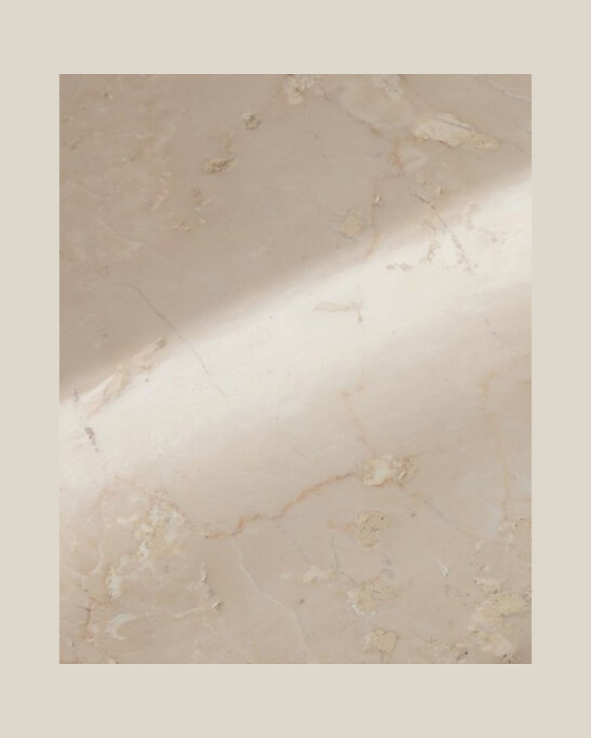 Close-up of PAD Tray's beige natural stone, subtle surface markings and softly curved recess.