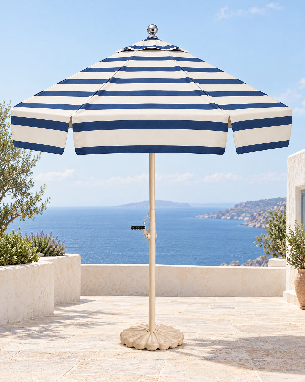 Riviera fully striped navy and ivory umbrella on a Mediterranean terrace