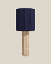 Roma Table Lamp, Large Faceted, Travertine Beige + Dark Blue, front hero view on bone background.
