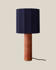 Roma Table Lamp, Large Faceted, Travertine Red + Dark Blue, on a bone background.