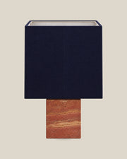 Roma Table Lamp, Small Square, Travertine Red + Dark Blue, front hero view on bone background.