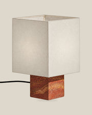 Roma Table Lamp, Small Square, Travertine Red + White, on a bone background.