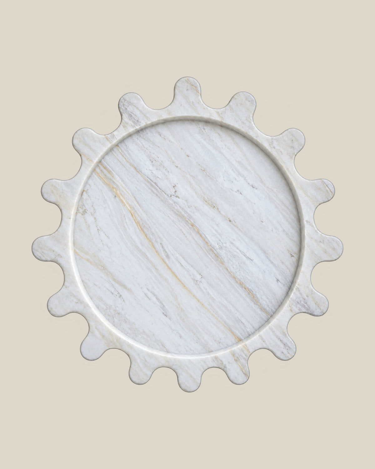 Sun Orbit Tray in Calacatta Gold natural marble, overhead view, rounded sun rays and recessed circular centre.